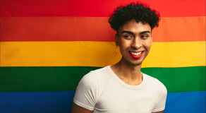Male With Red Lip Stick And Earring Looking Away And Smiling Photo