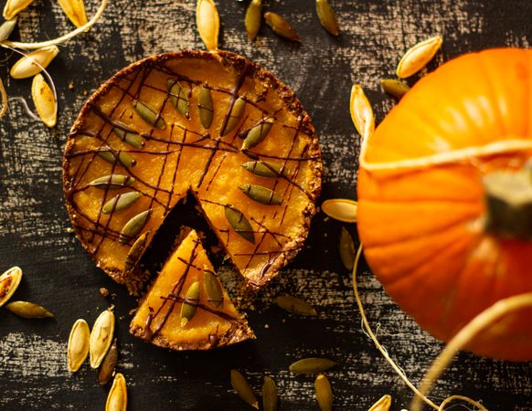 Top view of pumpkin pie on brown marble surface